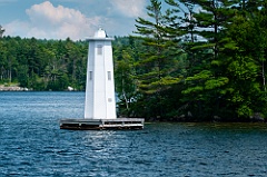 Herrick Cove Light by Rocky Shore of Lake Sunapee